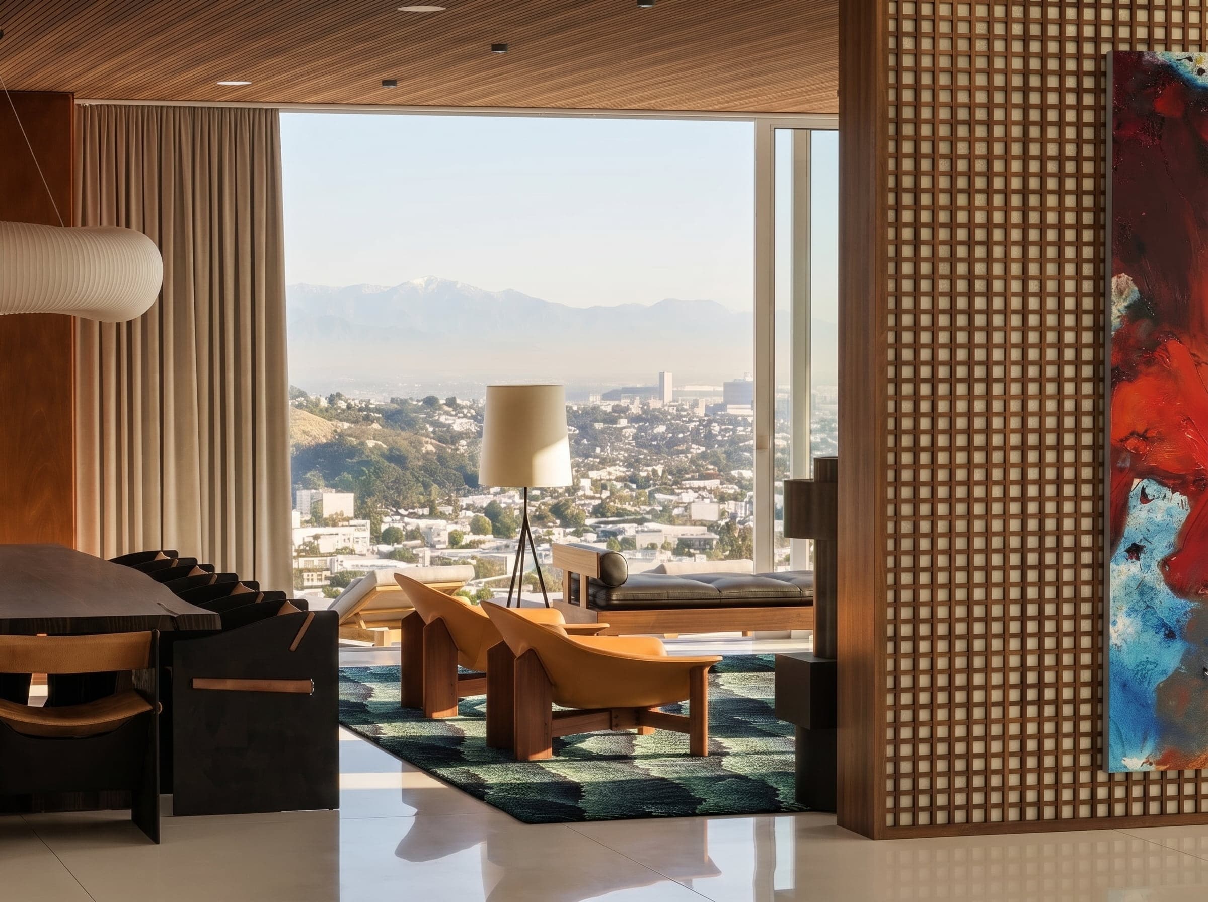 3D render of a Beverly Hills living room with floor-to-ceiling windows over Los Angeles, a wooden lattice screen and abstract red and blue artwork