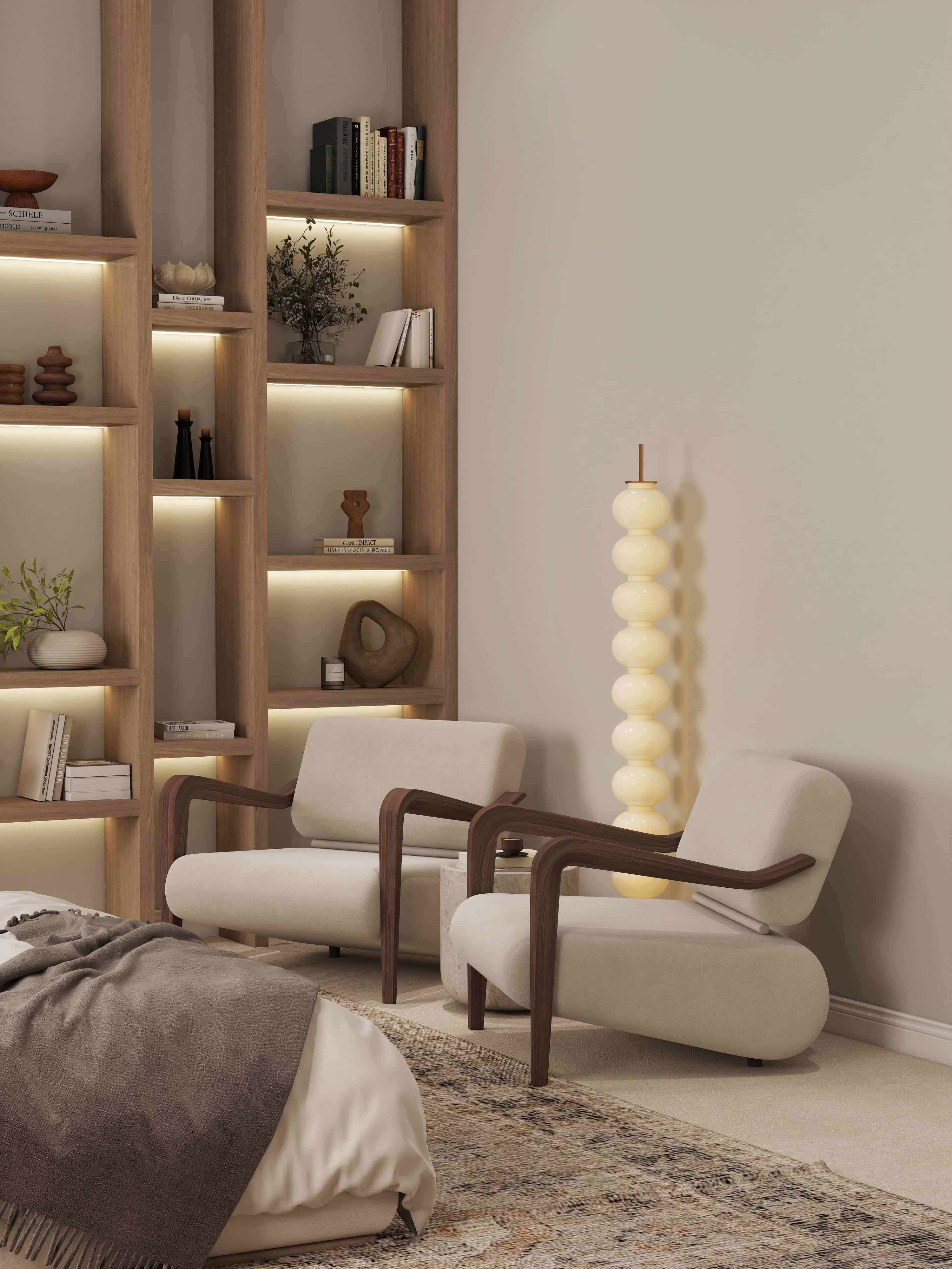 3D rendering of a bedroom reading corner with two cream armchairs, sculptural floor lamp and backlit oak bookshelves, Pasadena, California